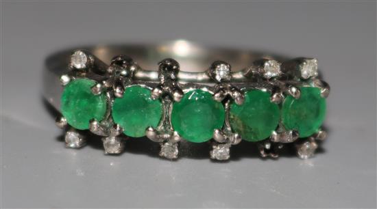 Emerald and diamond half hoop ring
